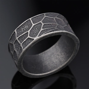 Retro punk style wide stainless steel ring with rustic honeycomb texture in dark grey