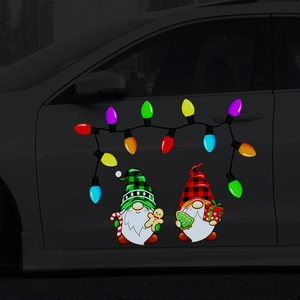 Close-up of magnetic Christmas gnome stickers with festive patterns on a dark car door