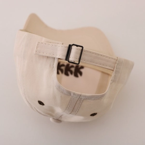 Beige cotton kids baseball cap with adjustable strap and metal buckle back view