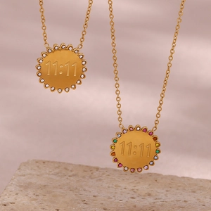 Detail of 18K gold plated sunflower necklaces with 11:11 engraving and zircon stones
