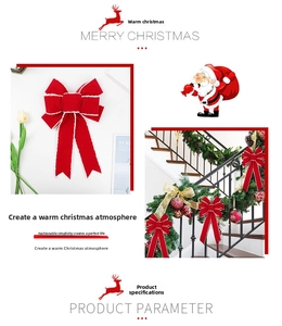 Detail of red velvet Christmas bows used as festive decorations on a green staircase garland