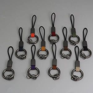 Porte-clés en cuir véritable avec anneau métallique en douze couleurs assorties