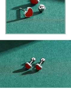 Macro view of S925 sterling silver red enamel heart stud earrings with screw back design