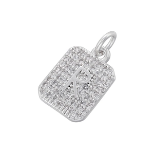 Detailed view of silver rectangular pendant with letter R and pavé cubic zirconia