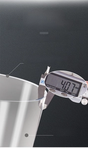 Close-up of caliper measuring the 4.07mm thick durable wall of a transparent waste bin