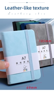Close-up of A7 mini ruled notebooks with skin-feel hardcovers and elastic bands