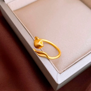 Macro detail of tulip flower ring with matte gold finish on jewelry box display