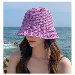 Detailed close-up showing the lavender purple straw weave texture and sun hat material