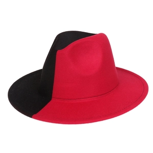 Close-up of black and rose red two-tone wool fedora hat with wide brim jazz style