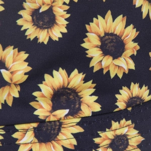 Black bucket hat featuring vibrant yellow sunflower floral prints on canvas fabric