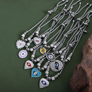 Vintage evil eye charm bracelets in multiple enamel colors with adjustable silver beads