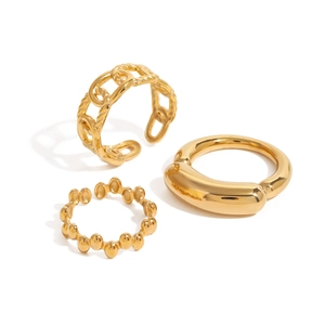 Three-piece set of polished golden stainless steel rings in chain, flat, and beaded styles