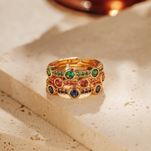 Detail of three-piece 18K gold plated stackable rings with colorful zircon gemstones