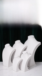 Set of five white minimalist portrait necklace display stands in various sizes