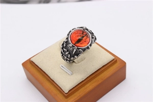 Gothic titanium steel ring featuring a red dragon eye stone and bat wing relief details