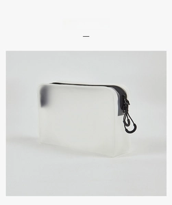 Close-up of translucent frosted storage bag featuring a black zipper and dual sliders