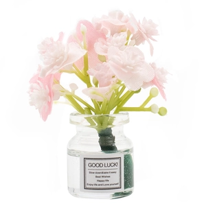 Charming floral car dashboard ornament with pink flowers in a glass wishing bottle