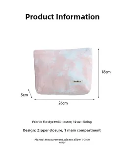 Detail view of tie-dye toiletry bag showing 26x18x5cm dimensions and zipper closure