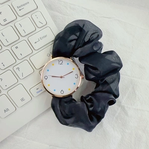 Elegant ribbon scrunchie watch in black silk with rose gold case and colorful dial
