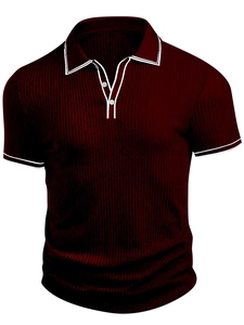 Detail of burgundy ribbed polo shirt featuring white striped collar and buttoned placket