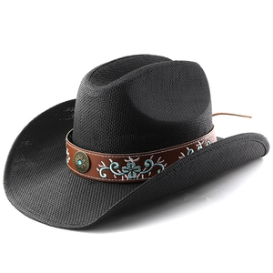 Close-up of black straw cowboy hat featuring floral embroidery and turquoise metal buckle