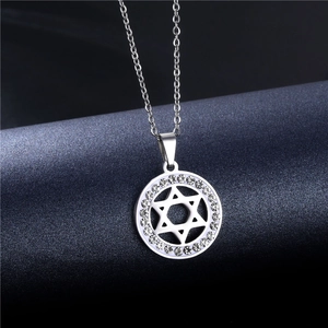 Macro shot of silver hollow Star of David pendant necklace with shimmering crystals