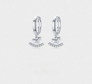 Close-up of S925 sterling silver rocking horse hoop earrings with white zircon inlay