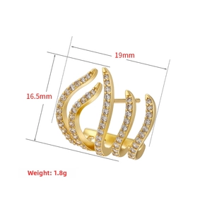 Detailed close-up of 18K gold-plated claw earrings with micro-pave white zircon stones
