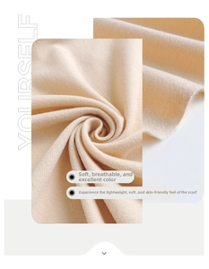 Macro detail of soft warm beige knitted cashmere-like fabric scarf with fine texture