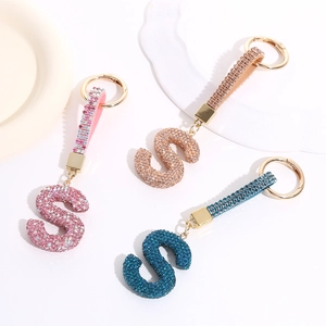 Sparkling crystal letter S keychain set in pink, champagne gold and peacock blue