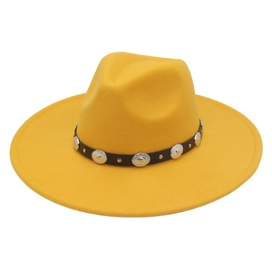 Detail of yellow wide brim felt hat featuring leather band with ornate silver conchos
