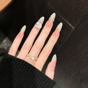 Rainbow Macchiato almond press-on nails with marble green patterns and 3D floral crystals