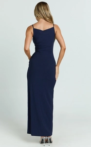 Detail of elegant dark blue long dress featuring a back U-shape cut and thin straps