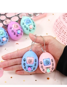 Hand holding portable rock paper scissors keychain toys in various macaron colors