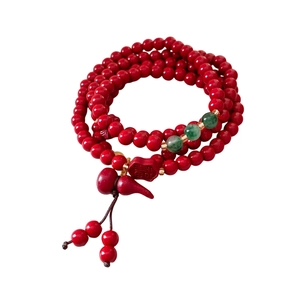 Red cinnabar beaded bracelet with green jade spacers, gourd charm and Fu character tag
