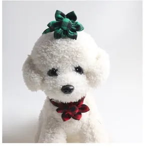 Detail of red and green plaid floral pet collars on a white model for British style