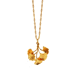 Golden ginkgo leaf pendant necklace with fine water wave chain on white background