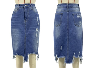 Detail view of dark blue denim midi skirt with ripped holes and irregular fringe hemline