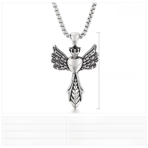 Detail view of angel wing crown heart pendant with 56x33mm dimensions and 14g weight