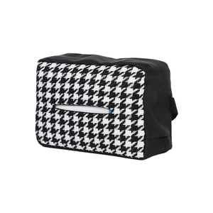Knitted houndstooth tissue box holder with black trim in a stylish 45-degree side view