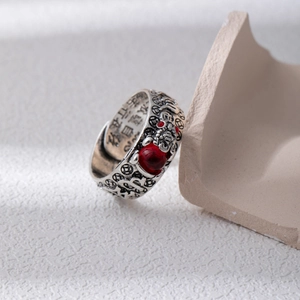 Vintage silver-style open ring with red garnet stone and engraved Buddhist scriptures