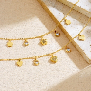 Elegant gold plated stainless steel bracelet with heart and flower crystal charms
