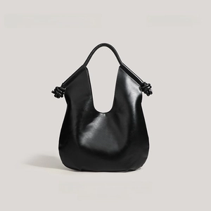 Minimalist black PU leather tote bag with unique knot details and large capacity