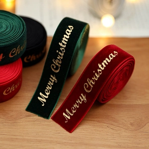 Velvet Christmas ribbon with gold Merry Christmas print for festive tree decorations