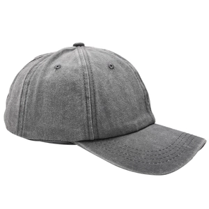 Detail of washed cotton baseball cap showing side stitching and breathable eyelets