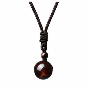 Handcrafted red tiger eye stone pendant with dark brown woven cord and polished beads