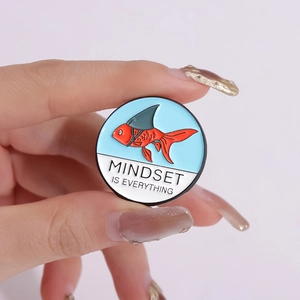 Round enamel koi fish brooch with shark fin and Mindset is Everything slogan