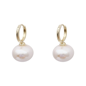 Elegant gold hoop earrings with large white pearl pendants in a minimalist French style