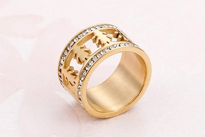 Detailed view of hollow figure gold ring with sparkling white zirconia pave edges