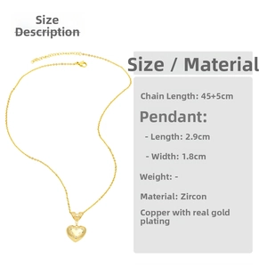 Detailed view of gold heart pendant with zircon star inlay and sizing measurements